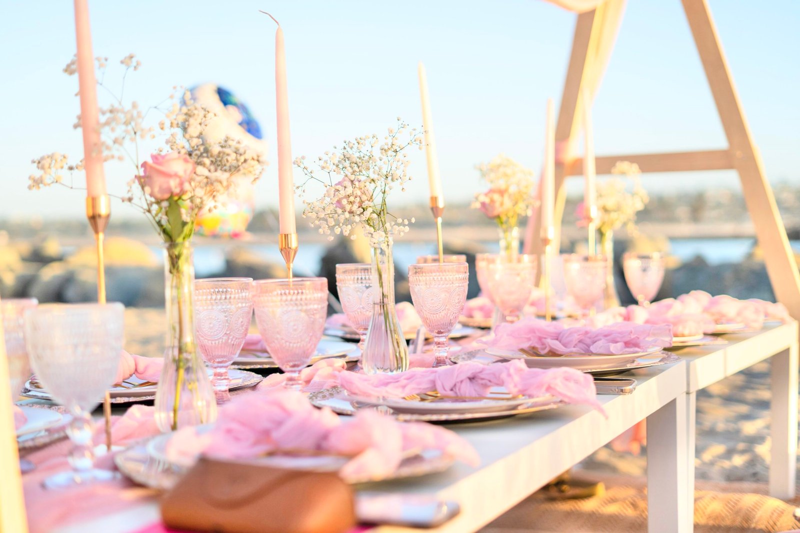 A Coastal Birthday Picnic with Rosé-Tinted Goblets and Blush Accents