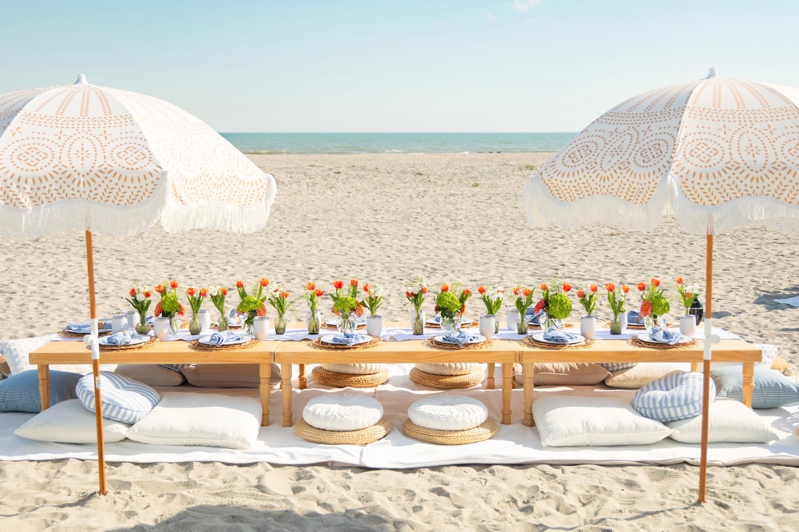 A Charleston Milestone Birthday Picnic with Bold Florals and a Violin-Cello Duo Held on the Beach